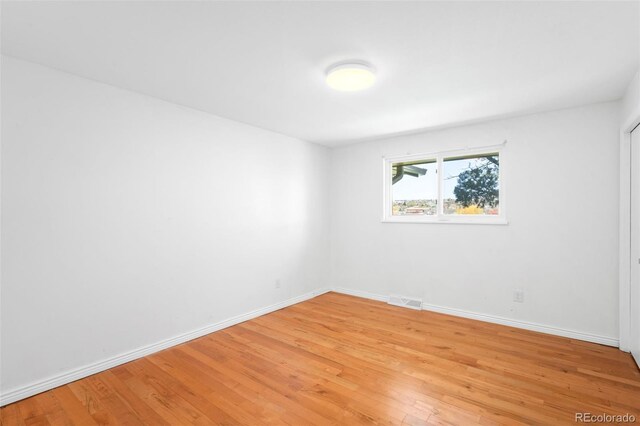 12940 W 75th Ave, Arvada, CO 80005 - empty room featuring light wood-style floors and baseboards