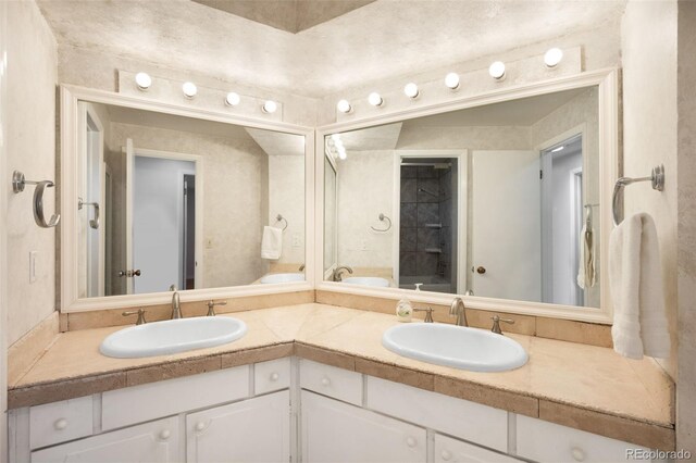 12940 W 75th Ave, Arvada, CO 80005 - full bathroom with double vanity and a tub