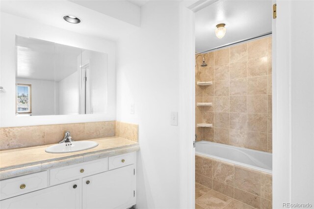 12940 W 75th Ave, Arvada, CO 80005 - full bath featuring vanity and tiled shower / bath