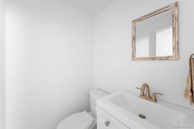 12940 W 75th Ave, Arvada, CO 80005 - half bathroom featuring toilet and vanity