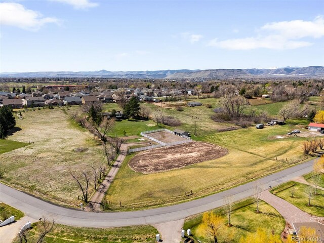 12940 W 75th Ave, Arvada, CO 80005 - aerial perspective of suburban area featuring a mountain backdrop
