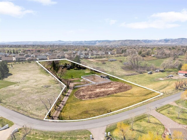 12940 W 75th Ave, Arvada, CO 80005 - aerial view of property's location featuring property parcel outlined and a mountain backdrop