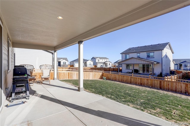 view of patio featuring a residential view and grilling area