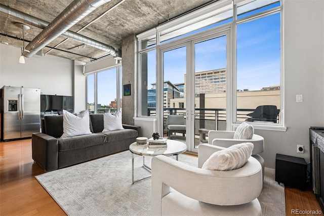 1401 Wewatta St Unit 911, Denver, CO 80202 - living room with wood finished floors