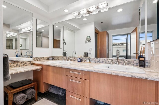 1401 Wewatta St Unit 911, Denver, CO 80202 - bathroom with tasteful backsplash, double vanity, recessed lighting, and tile patterned flooring