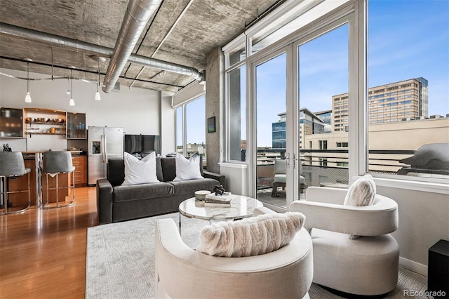 1401 Wewatta St Unit 911, Denver, CO 80202 - living area with wood finished floors and a city view