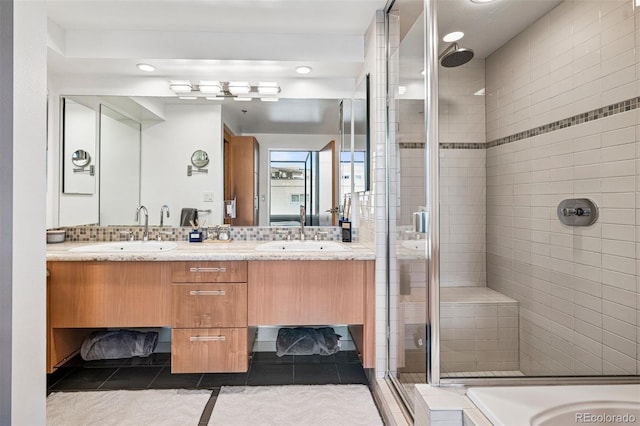 1401 Wewatta St Unit 911, Denver, CO 80202 - full bath featuring a stall shower, tile patterned floors, double vanity, and recessed lighting