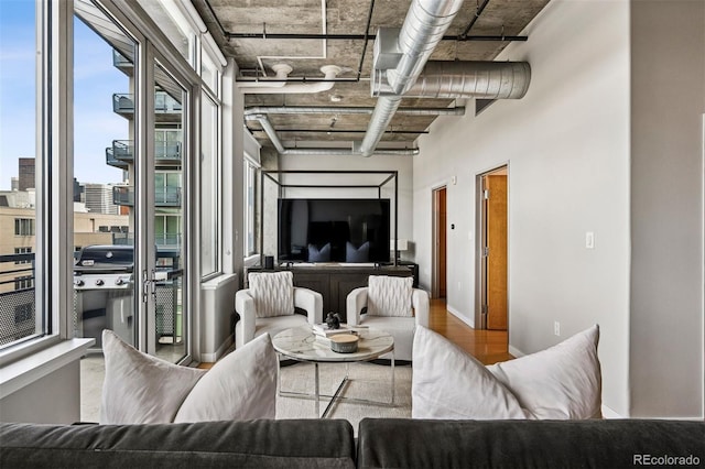 1401 Wewatta St Unit 911, Denver, CO 80202 - living area with wood finished floors and baseboards