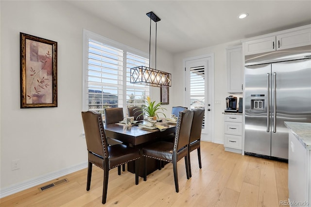 dining room featuring light hardwood / wood-style floors