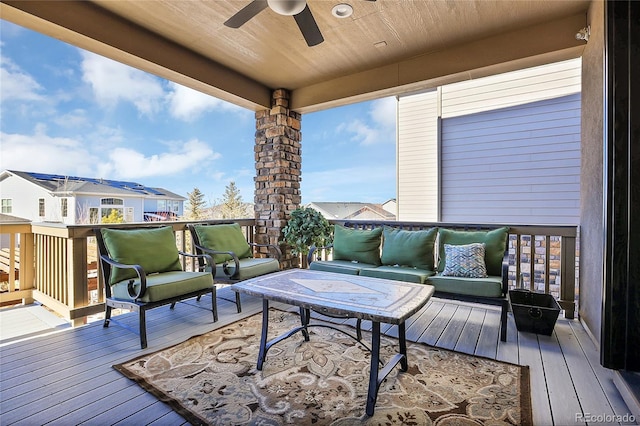 wooden deck with ceiling fan and an outdoor hangout area