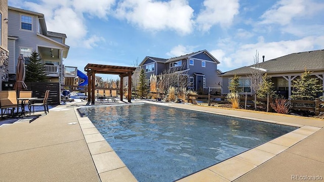 view of pool with a pergola and a patio area