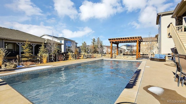 view of swimming pool featuring a patio area and a pergola