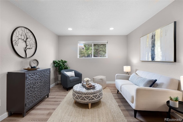 16359 W 10th Ave Unit T1, Golden, CO 80401 - living area featuring wood finished floors, baseboards, a textured ceiling, and recessed lighting
