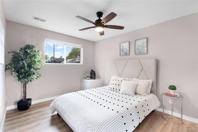 16359 W 10th Ave Unit T1, Golden, CO 80401 - bedroom with baseboards, light wood-style floors, and ceiling fan