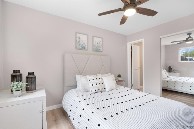 16359 W 10th Ave Unit T1, Golden, CO 80401 - bedroom with light wood-style flooring, baseboards, and a ceiling fan