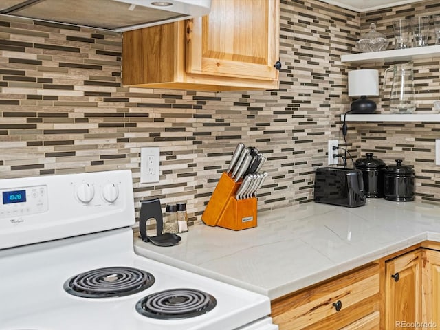 kitchen with exhaust hood, white range with electric cooktop, light countertops, and tasteful backsplash