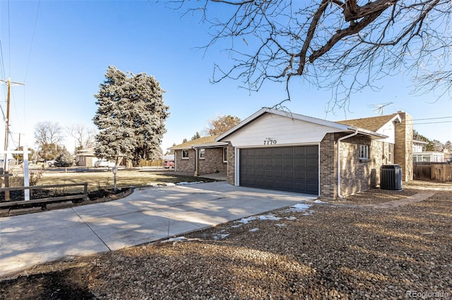 view of home's exterior featuring a garage and cooling unit