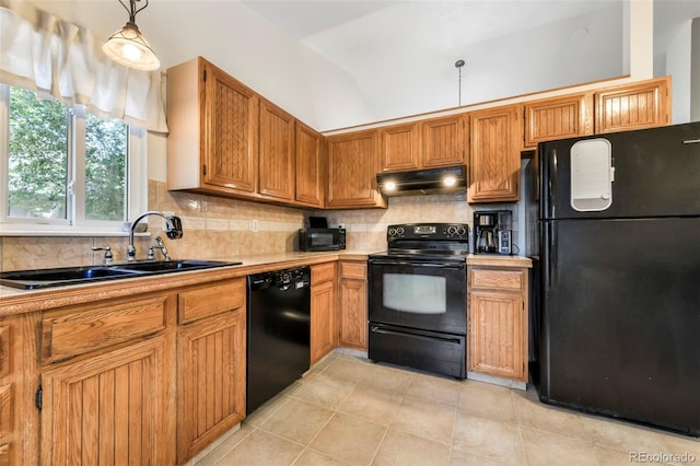1024 Bromefield Dr, Fountain, CO 80817 - kitchen with black appliances, under cabinet range hood, light countertops, and backsplash