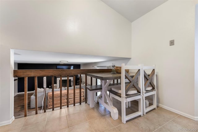 1024 Bromefield Dr, Fountain, CO 80817 - staircase featuring tile patterned flooring and lofted ceiling