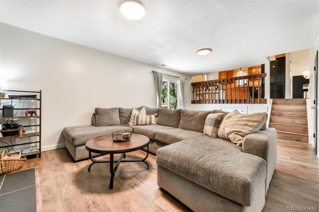 1024 Bromefield Dr, Fountain, CO 80817 - living room with light wood-style flooring and stairway