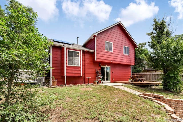 1024 Bromefield Dr, Fountain, CO 80817 - rear view of house featuring solar panels and a deck