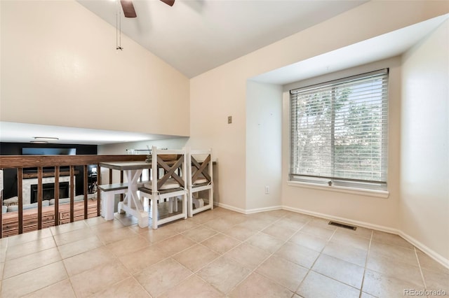 1024 Bromefield Dr, Fountain, CO 80817 - tiled spare room featuring vaulted ceiling and ceiling fan