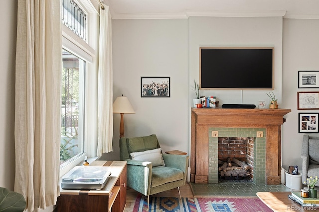 2445 N Franklin St, Denver, CO 80205 - living room featuring a tile fireplace, ornamental molding, and tile patterned flooring