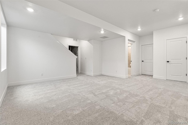 empty room featuring light colored carpet