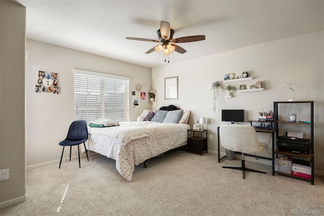 bedroom featuring ceiling fan and baseboards