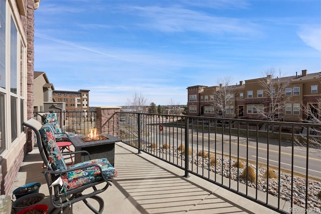 balcony featuring an outdoor fire pit