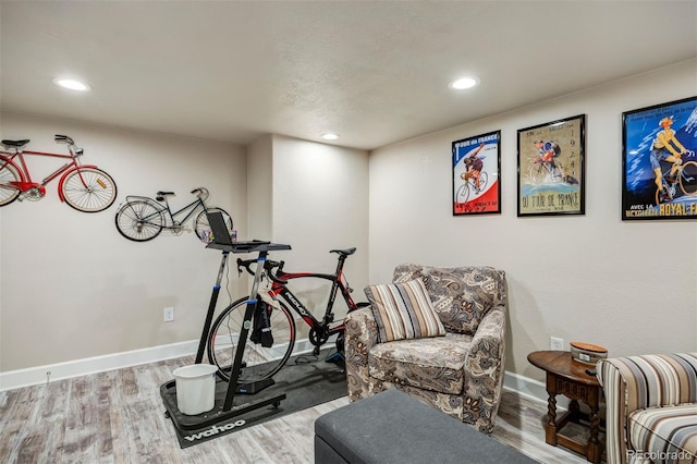 workout room with recessed lighting, wood finished floors, and baseboards