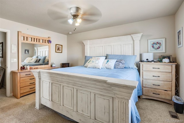 bedroom featuring light carpet and ceiling fan