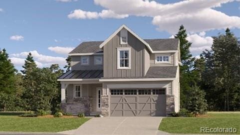 view of front of home with a garage and a front lawn