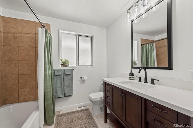 full bathroom featuring tile patterned flooring, vanity, toilet, and shower / bath combo with shower curtain