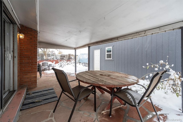 view of snow covered patio