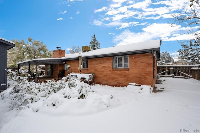 view of snow covered property