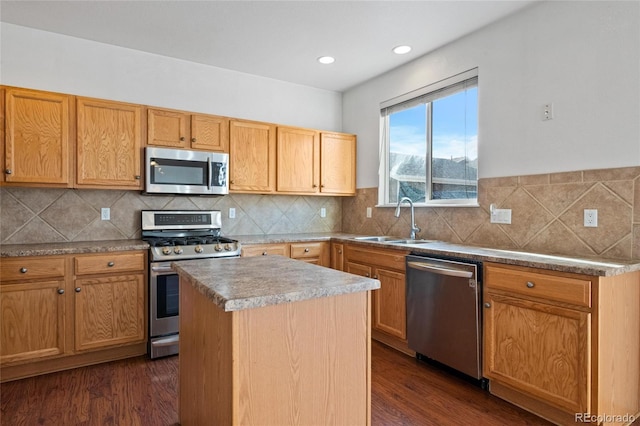 kitchen with dark hardwood / wood-style flooring, a center island, stainless steel appliances, and sink