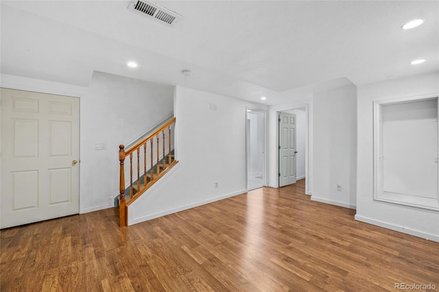 spare room featuring hardwood / wood-style flooring