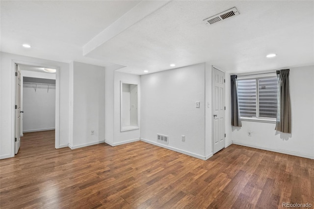 spare room featuring hardwood / wood-style floors