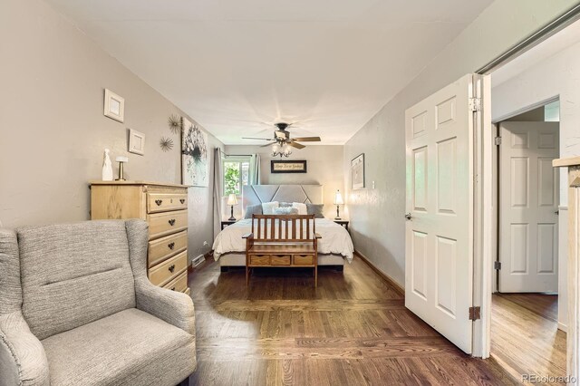 8600 W 2nd Ave, Lakewood, CO 80226 - bedroom with dark wood-type flooring, baseboards, and a ceiling fan