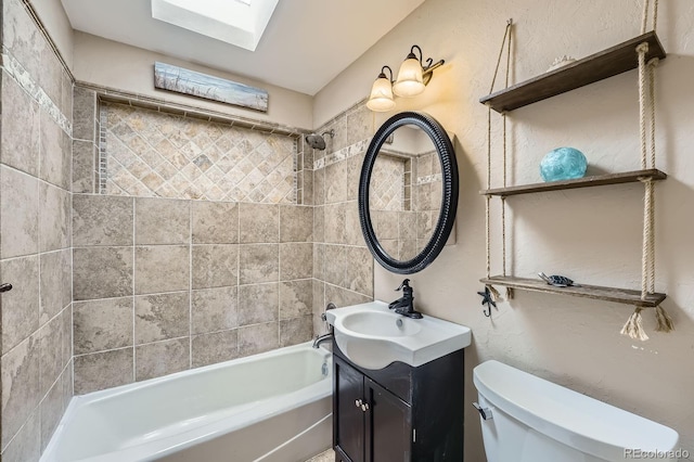 8600 W 2nd Ave, Lakewood, CO 80226 - full bathroom featuring vanity, toilet, shower / washtub combination, and a skylight