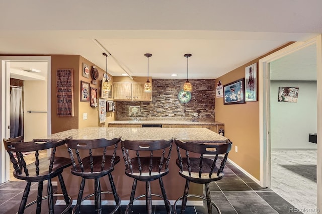 8600 W 2nd Ave, Lakewood, CO 80226 - indoor wet bar featuring decorative backsplash, decorative light fixtures, and dark tile patterned flooring