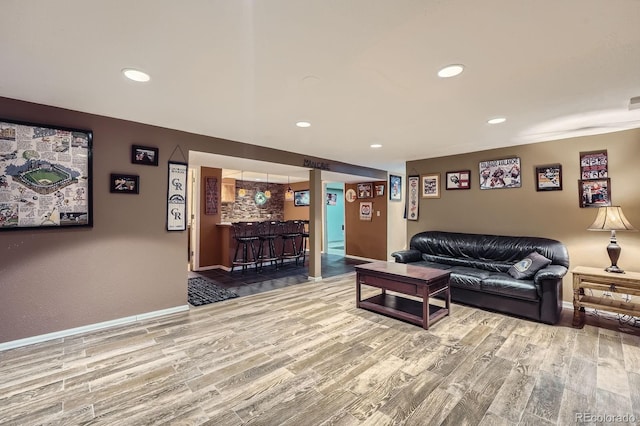 8600 W 2nd Ave, Lakewood, CO 80226 - living area with bar, wood finished floors, recessed lighting, and baseboards