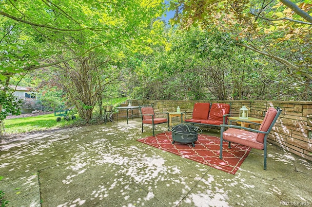 8600 W 2nd Ave, Lakewood, CO 80226 - view of patio featuring an outdoor fire pit