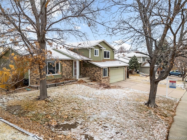 view of front of home with concrete driveway and brick siding