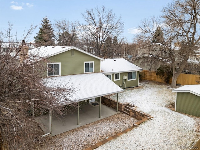 back of house featuring a patio area and fence