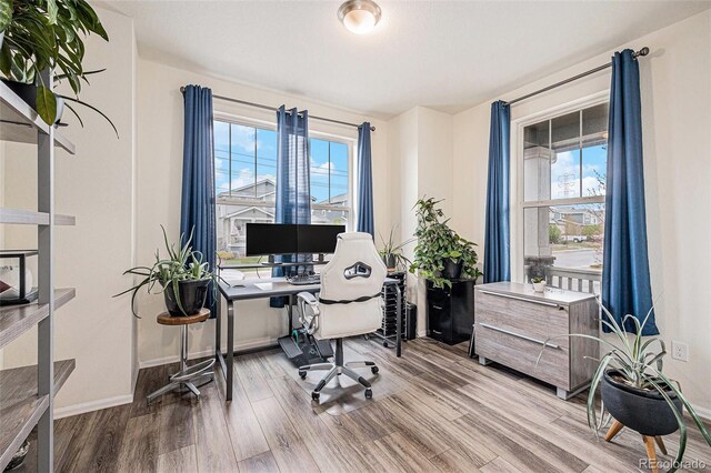 26385 E Canal Pl, Aurora, CO 80018 - home office featuring wood finished floors and baseboards