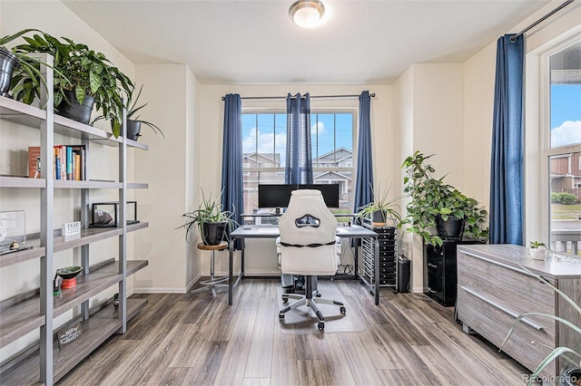 26385 E Canal Pl, Aurora, CO 80018 - home office featuring wood finished floors and baseboards