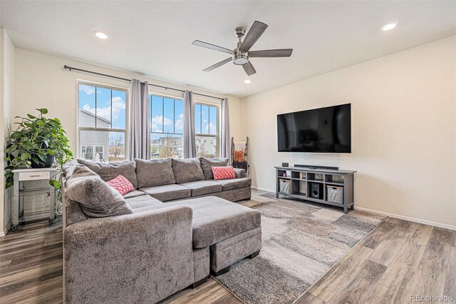 26385 E Canal Pl, Aurora, CO 80018 - living room featuring ceiling fan, wood finished floors, baseboards, and recessed lighting