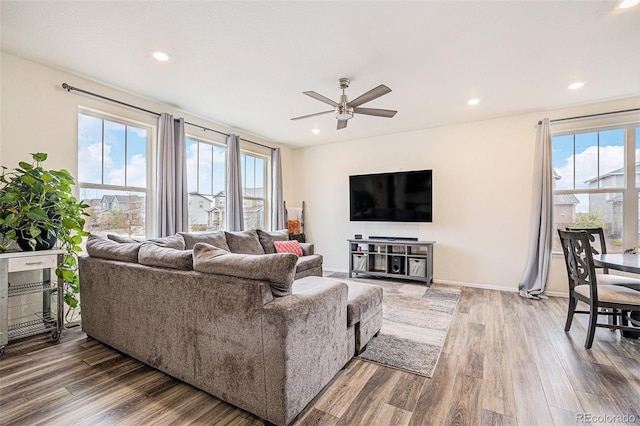 26385 E Canal Pl, Aurora, CO 80018 - living room featuring healthy amount of natural light, wood finished floors, ceiling fan, and recessed lighting
